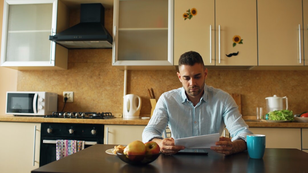young adult reviewing health insurance documents