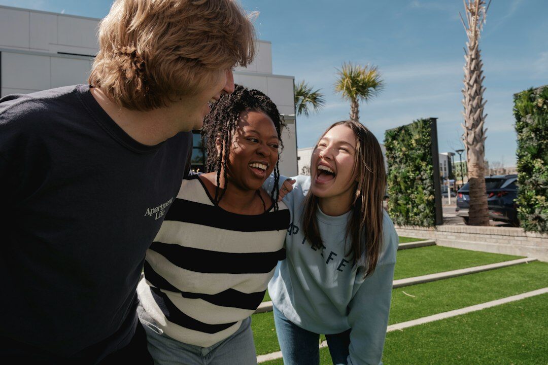 diverse young adults outdoors smiling