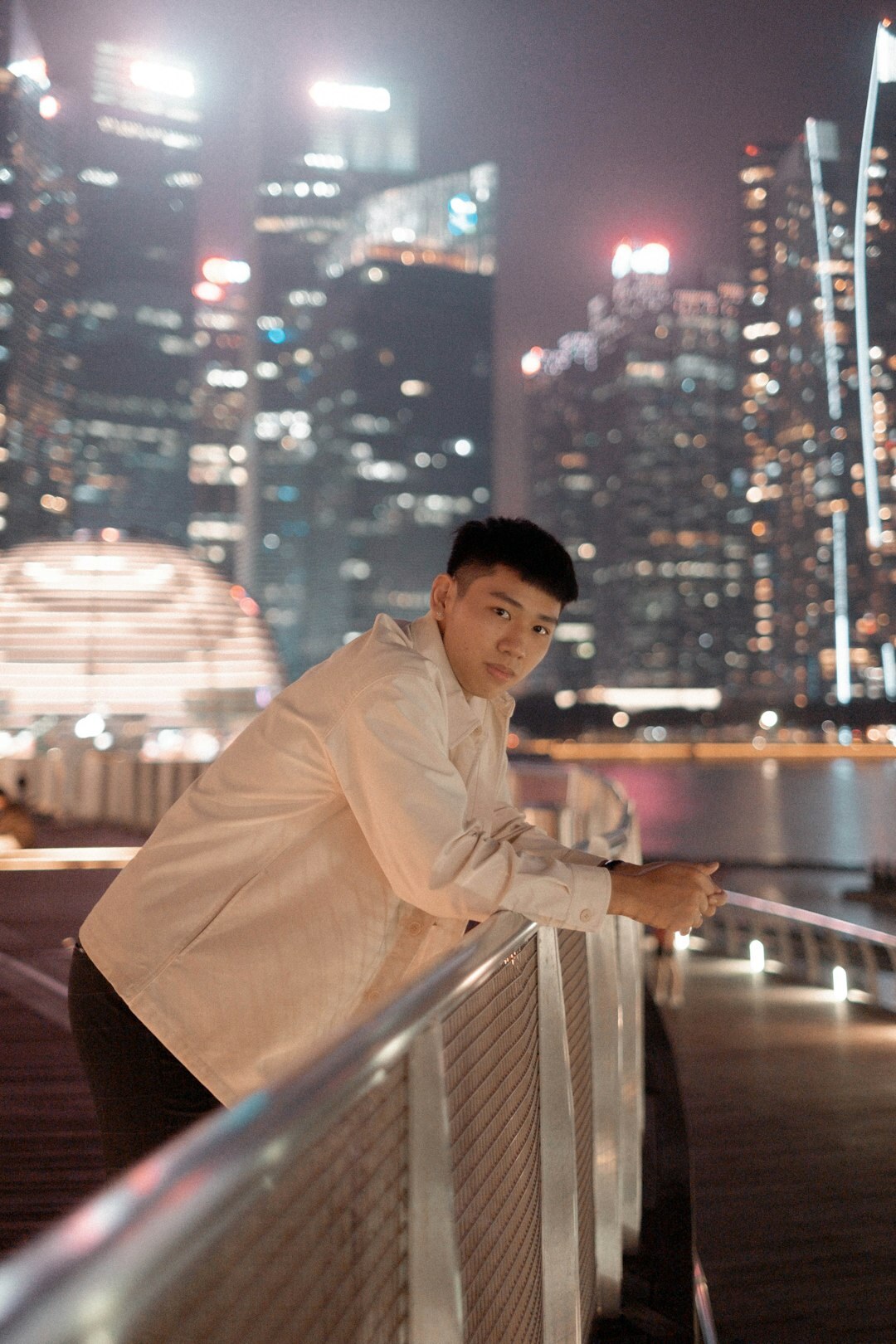 Studio portrait of a smiling Chinese Singaporean man in business attire