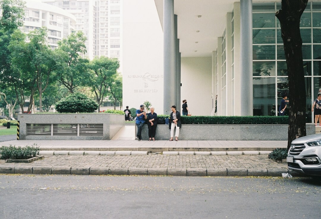 Diverse team of Singaporean insurance advisors discussing a policy in a bright modern office